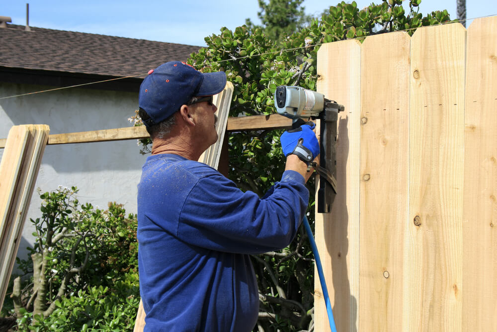 removing an old fence panel